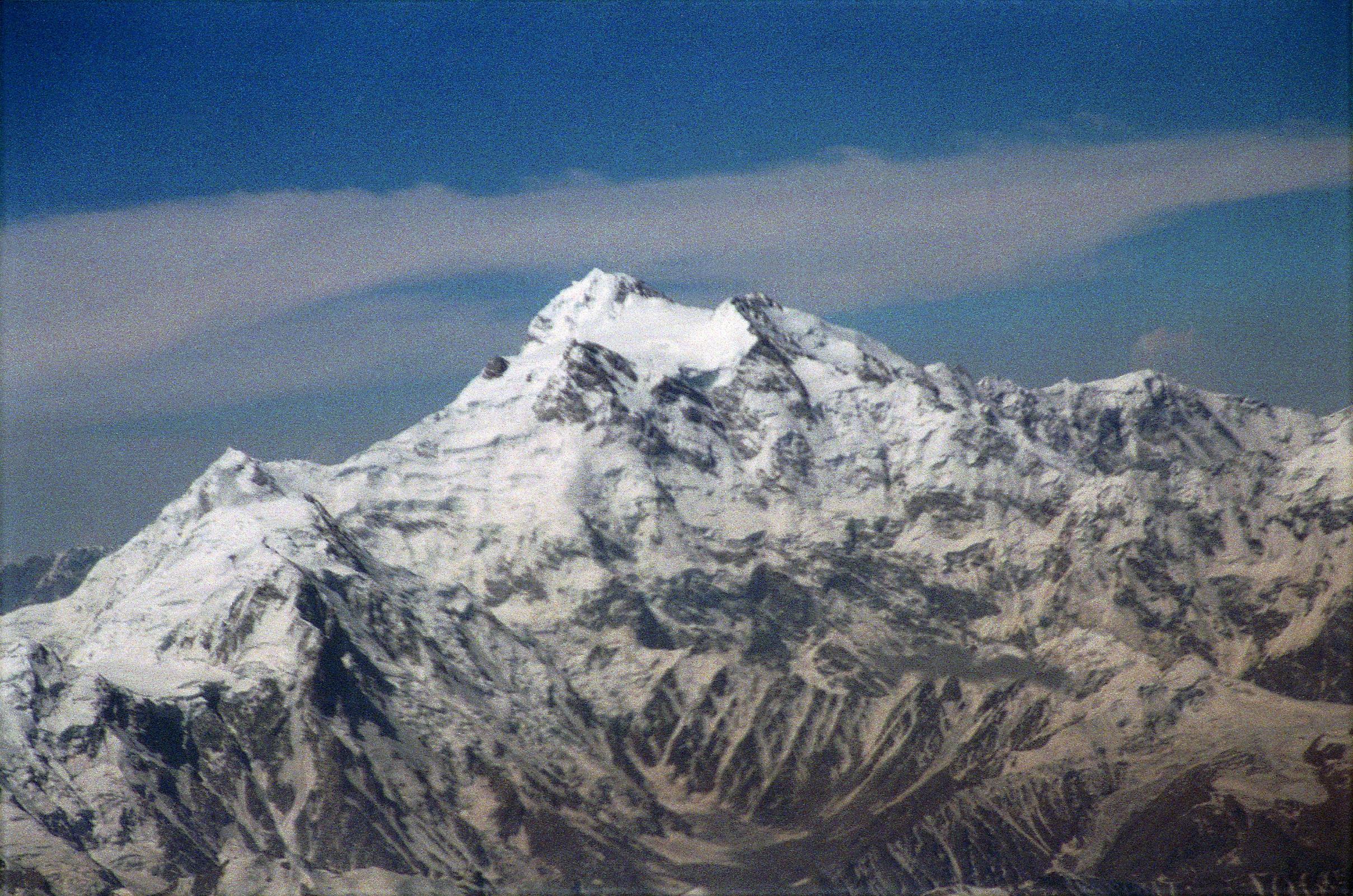 10 Nanga Parbat Rakhiot Face, Rakhiot Peak, Silver Saddle, East Peak, Silver Plateau, Summit, North Peaks On Flight From Islamabad To Skardu The flight from Islamabad to Skardu continues to fly around Nanga Parbat with Hermann Buhl�s route of first ascent becoming perfectly visible. Rakhiot Peak leads up to the Silver Saddle between the Nanga Parbat Southeast and East Peaks, and up to the summit with the North Peaks on the right.